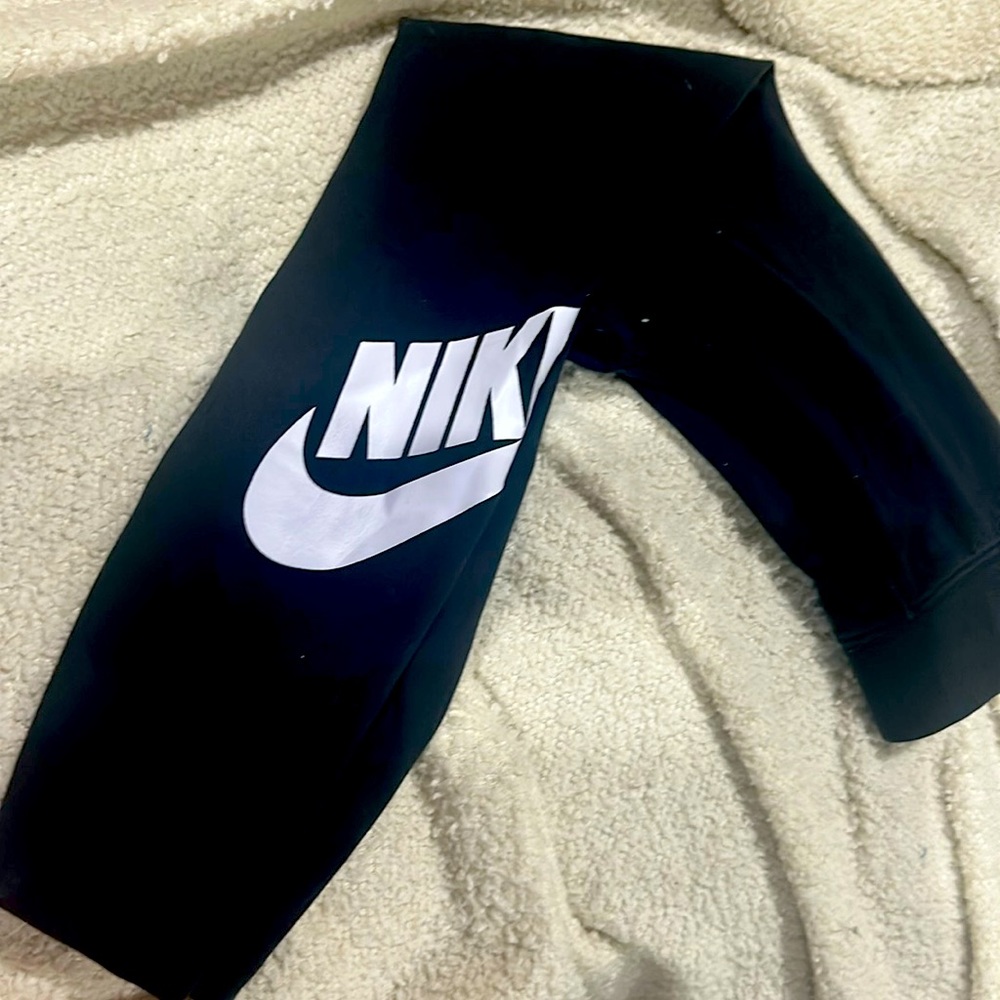 Womans black Nike leggings.